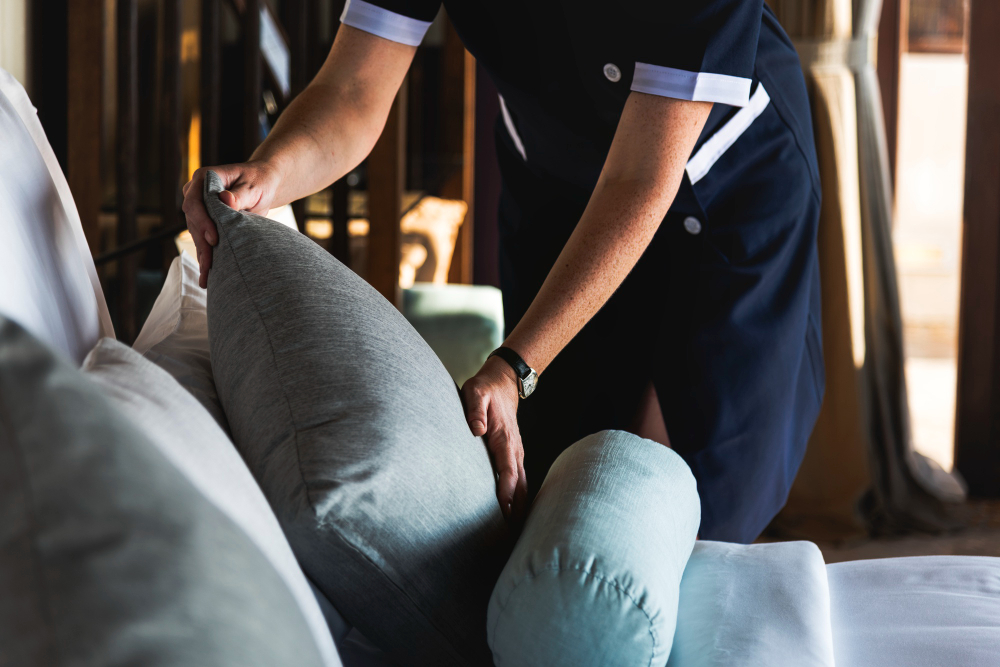housekeeper-cleaning-hotel-room